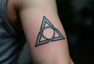 A triquetra, in green and blue tattoo idea