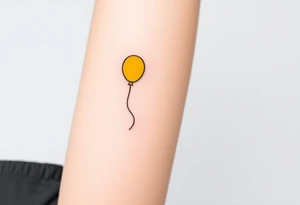 small yellow balloon without string 
with letters osaat on bicep tattoo idea