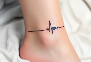 A subtle black EKG line wrapping around the ankle, punctuated by a small, blue heart. tattoo idea