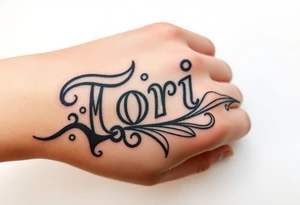 Name Tori with a lot tribal tattoo idea