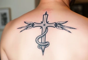 A cross that stabs the snake from the bottom tattoo idea