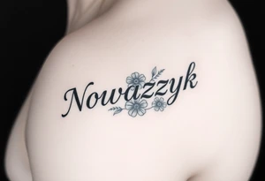 The word "Nowaczyk" with three flowers on the lower tricep, medium size tattoo idea