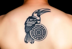 picture of a Kalimantan hornbill with a picture of a woven shield mat tattoo idea
