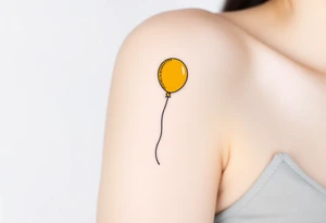 small yellow balloon without string 
with letters osaat on bicep tattoo idea