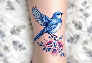 Blue bird with thick floral at the bottom tattoo idea