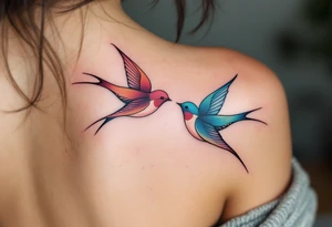 Stylized swallows in dusty rose and deep blue flying toward each other on the back shoulders signify freedom and loyalty. tattoo idea