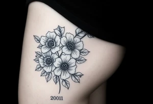 Year 2001 thigh tattoo with flowers tattoo idea
