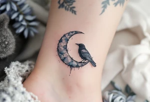 A silver crescent moon holding a small black raven, perched above protective script. tattoo idea