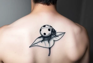 Ladybug reed sitting on a leaf tattoo idea