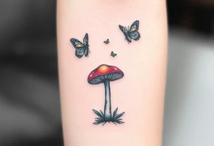 colorful 
mushroom with 2 butterflies above it on your lower inner arm tattoo idea