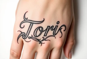 Name Tori with a lot tribal tattoo idea
