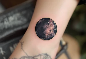 A solid black circle with a thin gold outline, evoking elegance and strength. tattoo idea