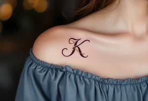Elegant serif K in deep burgundy, with a gold ribbon woven through the letter's arms. tattoo idea