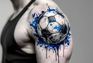 A dripping-ink soccer ball in grayscale with splashes of cobalt blue for contrast. tattoo idea