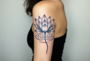 serene lotus flower emerging from sacred waters with ripples tattoo idea