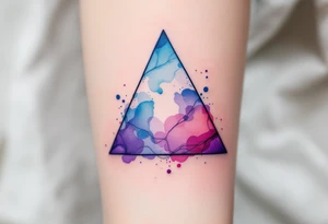 A watercolor triangle filled with splashes of blue, pink, and purple, representing creativity and fluidity. tattoo idea