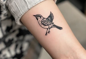 bird with music symbol tattoo idea
