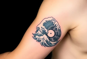 waves crashing into a vinyl record tattoo idea