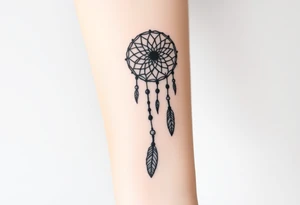 native dreamcatcher with flowing feathers and sacred beads tattoo idea