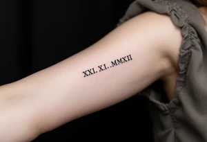 Elegant XXI.XI.MMXII in dark gray ink styled with subtle shadowing for a stone-carved effect. tattoo idea