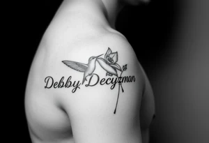 A tattoo on the forearm with the name Debby Deguzman with a humming bird and a rose tattoo idea