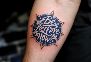 "Be Here Now" in monoline script, navy blue ink with a circle of stars around it, dreamy and grounding. tattoo idea