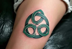 A bold Celtic triskeles  in deep emerald green, with intricate knotwork woven into each spiral, symbolizing eternal growth and balance. tattoo idea