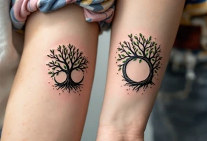 Two matching couples man and women tattoos black tree rings with a splash of green leaves tattoo idea