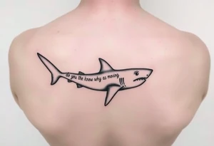 Small Whale shark on back by spine with the words “do you know why a shark keeps moving”wrapped around the shark tattoo idea
