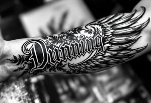 Dunning,on left forearm details include angel wing, greek type of font,jungle leaves , tiger claw scratch tattoo idea