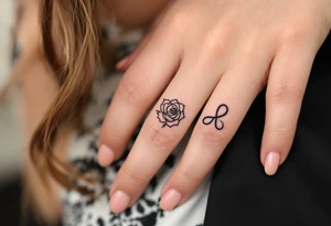 A rose ring with a small infinity symbol tattoo idea