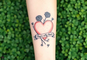 a big pale pink heart in a huge patch of green shamrocks, and a few purple thistles with a banner across the heart that says Peg 'o My Heart tattoo idea