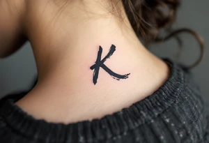 Brushstroke K painted with bold black ink, Japanese sumi-e style with subtle red stamp mark in the corner. tattoo idea