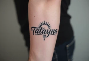 Forearm tattoo for a man using the name “Tatayana” Starting from the wrist, stretching to the elbow with the sun and moon Incorporated tattoo idea