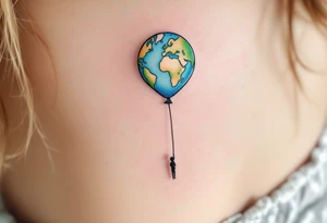 An Earth-shaped balloon in sky blue and grass green floats upward from a black string held by a tiny figure. tattoo idea
