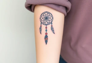 native dreamcatcher with flowing feathers and sacred beads tattoo idea