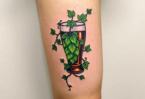 A hop vine wrapping around a pint glass, with delicate tendrils and leaves in vibrant green shades tattoo idea