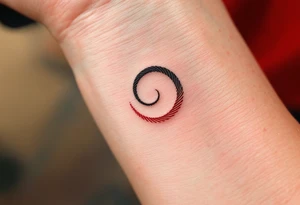 A delicate black spiral fading into fine red lines, symbolizing personal growth and passion. tattoo idea
