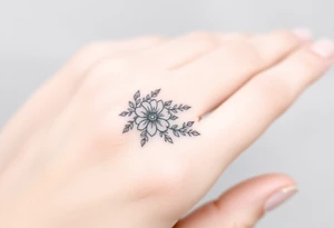 A delicate floral pattern around the entire circumference of the finger, inspired by wedding flowers, such as roses, peonies or lavender. tattoo idea