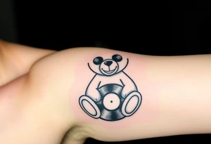 minimalist teddy bear with vinyl records as eyes smiling and sitting on a record yer tattoo idea