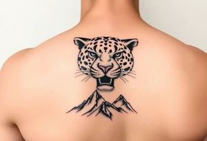 Jaguar face in the arm close to elbow mountains at the bottom close to the wrist tattoo idea