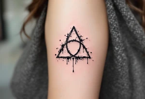 An ink-drip triquetra, with deep black edges fading into an artistic splatter effect tattoo idea