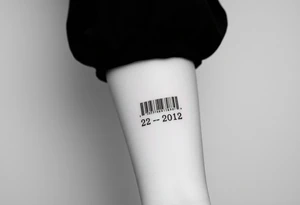 A sleek, minimalist barcode with the couple’s wedding date (22 - 12 - 2012) hidden in the numbers under barcode tattoo idea