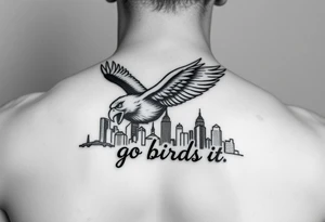 Philadelphia Eagle classic bird flying over Philadelphia city skyline with the words go Birds under it on bicep tattoo idea