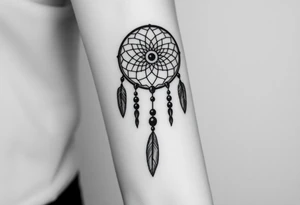 native dreamcatcher with flowing feathers and sacred beads tattoo idea