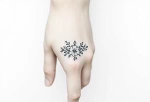 A delicate floral pattern around the entire circumference of the finger, inspired by wedding flowers, such as roses, peonies or lavender. tattoo idea