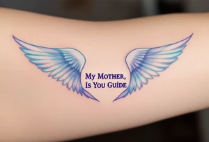 A pair of angel wings in light blue and lavender with “My Mother, Is My Guide” between them. tattoo idea
