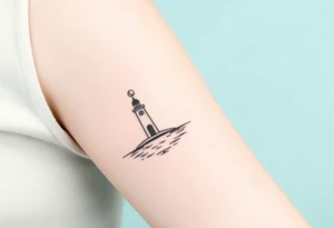 Girly light house on water with crescent moon tattoo idea