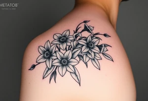 realistic daisies, daffodils, lily of the valley covering bicep for woman tattoo idea