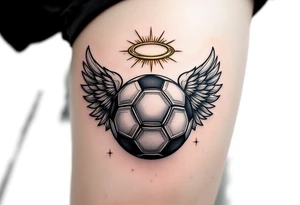 A black and gray soccer ball with angel wings and a golden halo above. tattoo idea